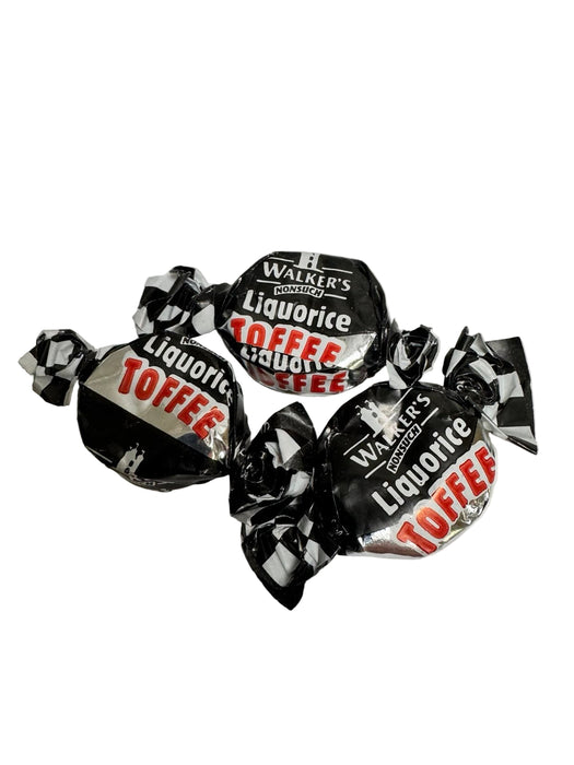 Three pieces of Walker's Liquorice Toffee on a white background